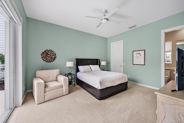 carpeted bedroom with ceiling fan, ensuite bath, and access to outside