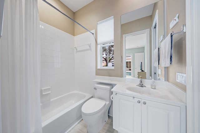 full bathroom with vanity, shower / bathtub combination, and toilet