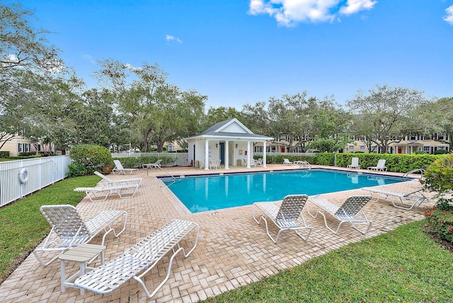 view of swimming pool with a patio