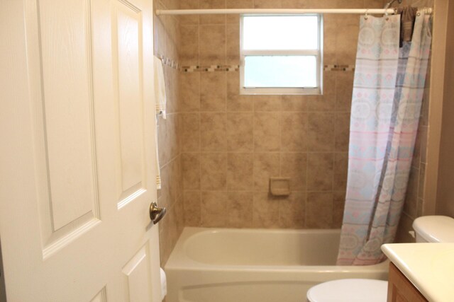 full bathroom featuring vanity, toilet, and shower / bath combo with shower curtain