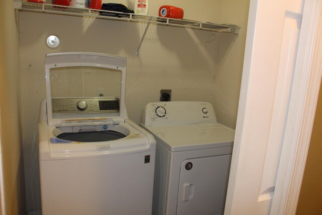 washroom with separate washer and dryer