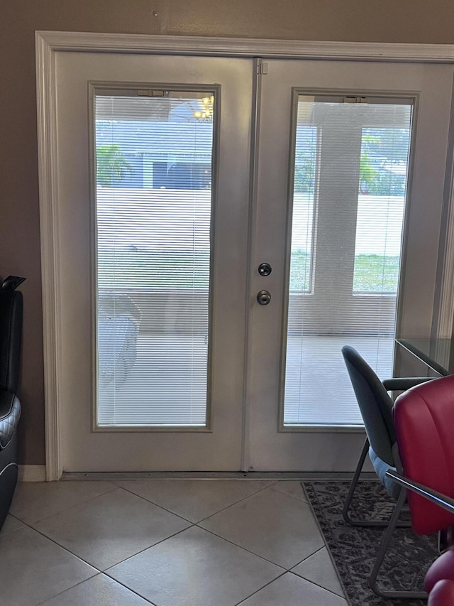 entryway featuring plenty of natural light and light tile patterned floors