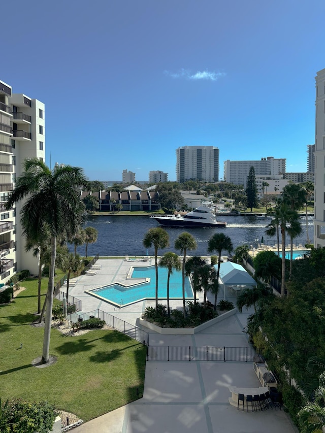 exterior space with a lawn and a water view