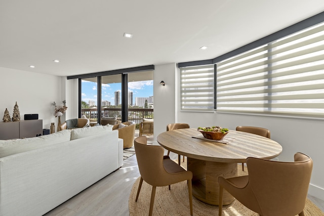 dining area with light hardwood / wood-style flooring