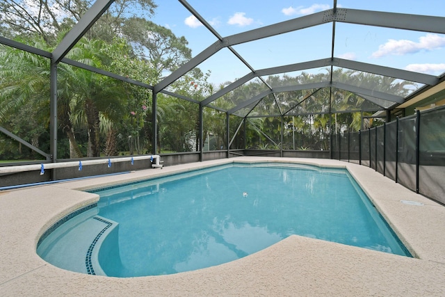 view of pool featuring a lanai