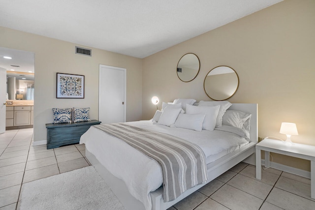 tiled bedroom with ensuite bath