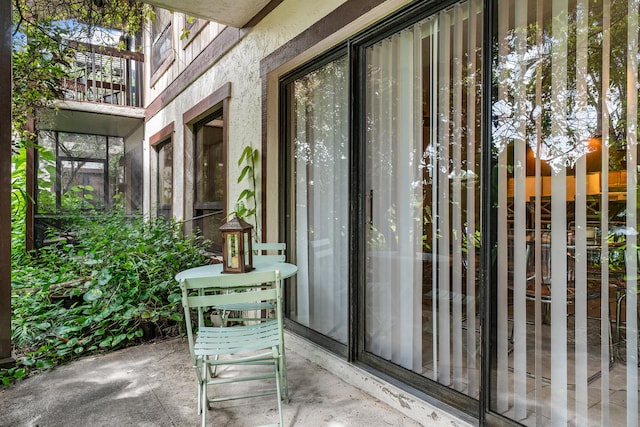 entrance to property with a patio