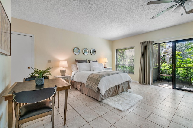 bedroom featuring access to exterior, a textured ceiling, light tile patterned floors, and ceiling fan