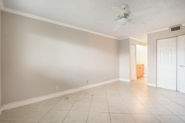 unfurnished bedroom featuring crown molding, ceiling fan, and light tile patterned flooring