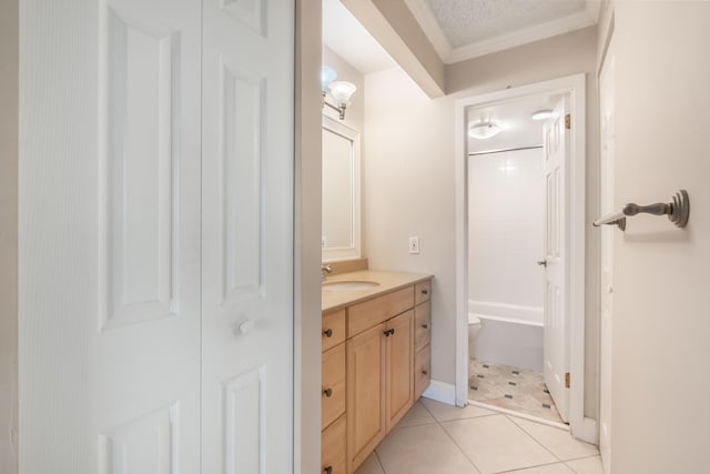 full bathroom featuring vanity, ornamental molding, toilet, tile patterned floors, and a textured ceiling