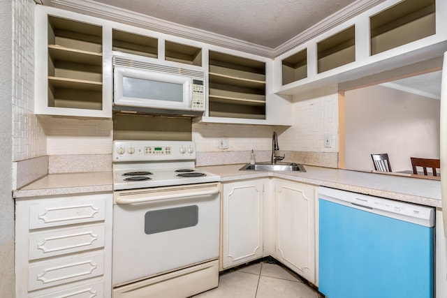 kitchen featuring white cabinetry, sink, ornamental molding, light tile patterned floors, and white appliances