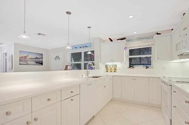 kitchen featuring hanging light fixtures, white appliances, sink, and white cabinets