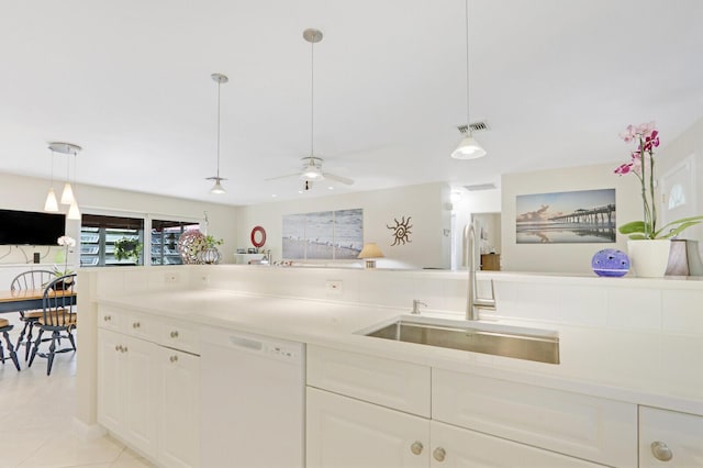 kitchen with light tile patterned flooring, sink, dishwasher, pendant lighting, and ceiling fan