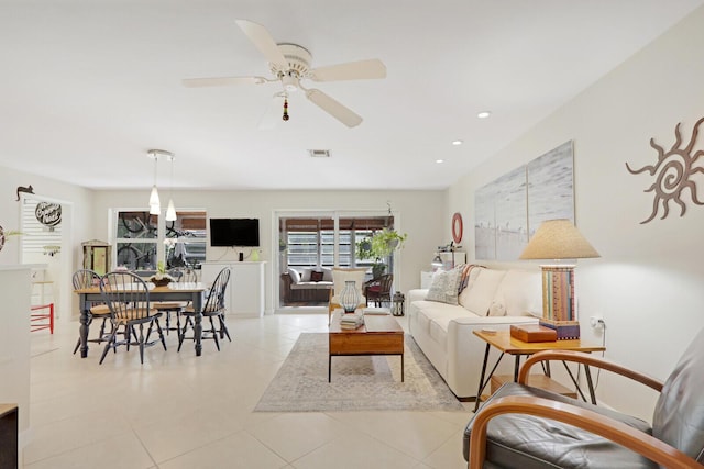 tiled living room featuring ceiling fan