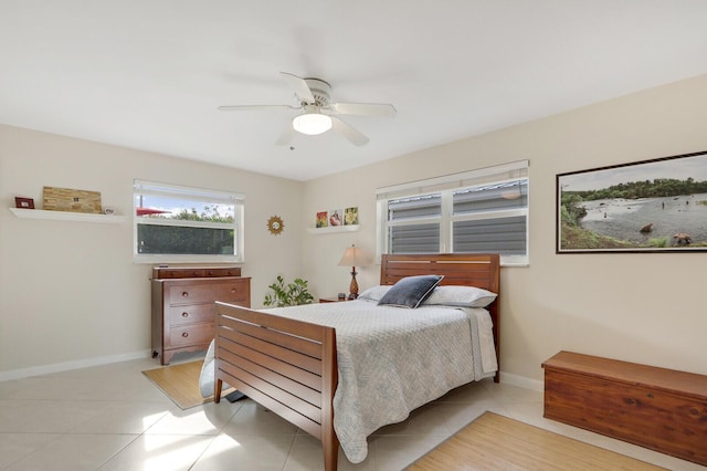 tiled bedroom with ceiling fan