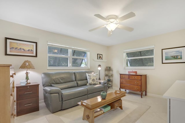 living room with light tile patterned floors and ceiling fan