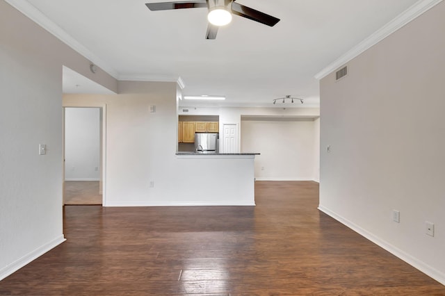 unfurnished living room featuring crown molding, dark wood-type flooring, and ceiling fan