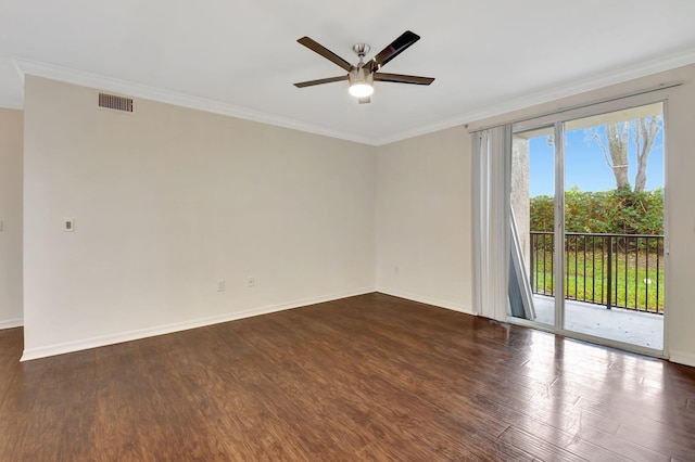 spare room featuring crown molding, ceiling fan, and dark hardwood / wood-style floors