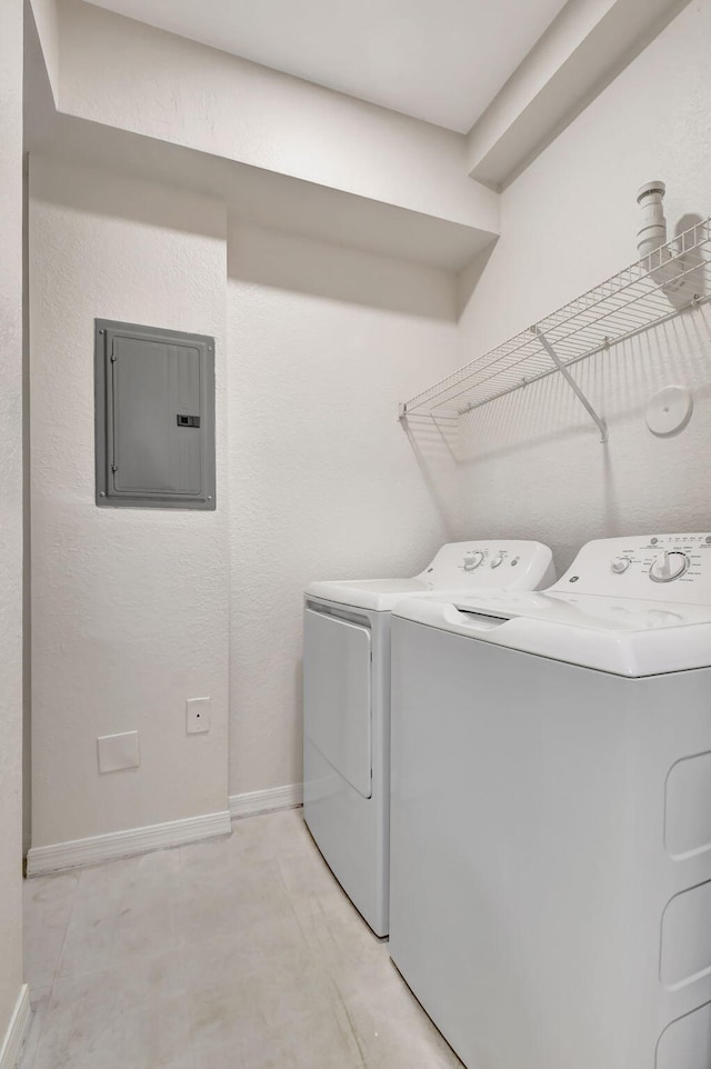 laundry area with separate washer and dryer and electric panel