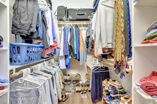 spacious closet featuring hardwood / wood-style flooring