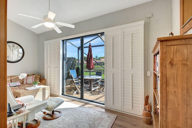 entryway featuring hardwood / wood-style flooring, vaulted ceiling, and ceiling fan