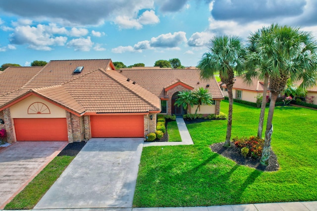 view of front of house featuring a garage and a front yard