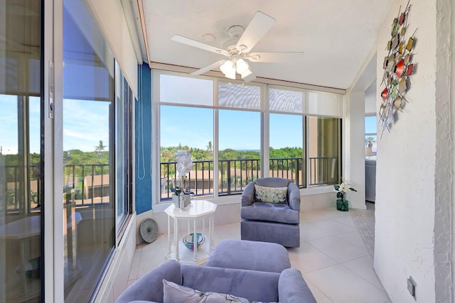 sunroom featuring ceiling fan