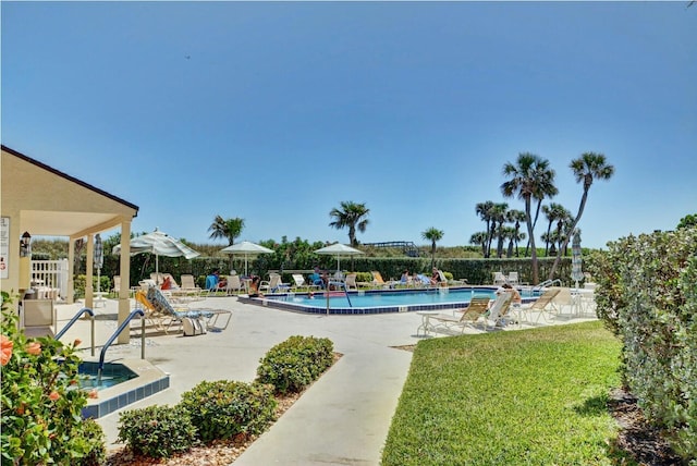 view of swimming pool featuring a patio area