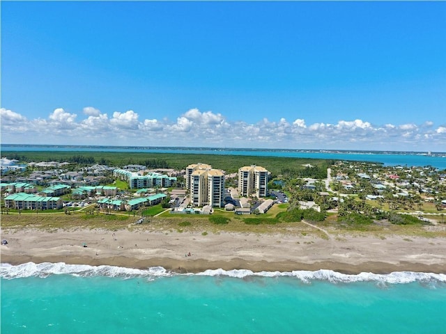 aerial view featuring a water view and a beach view