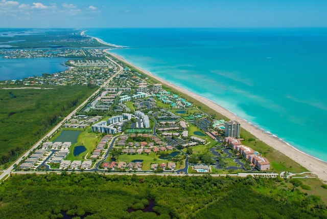 bird's eye view featuring a water view and a view of the beach