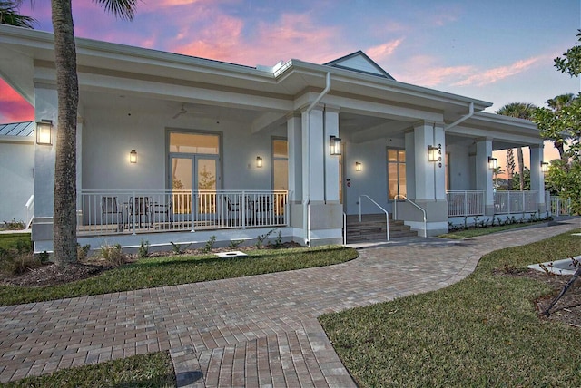 view of front of home featuring a yard and covered porch