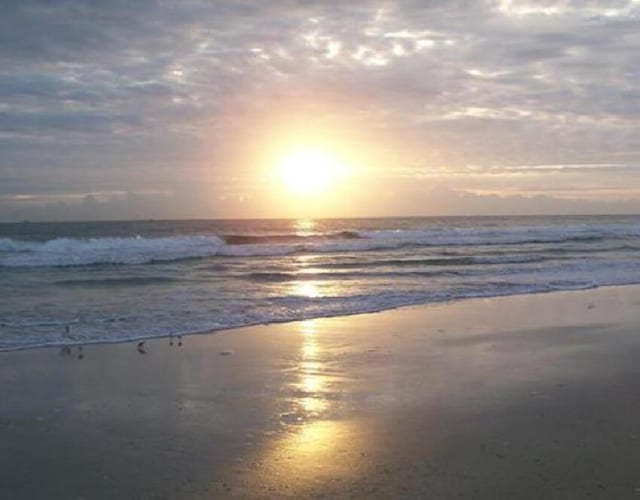 property view of water featuring a beach view