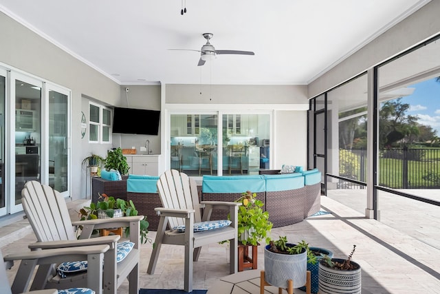 sunroom / solarium featuring sink and ceiling fan