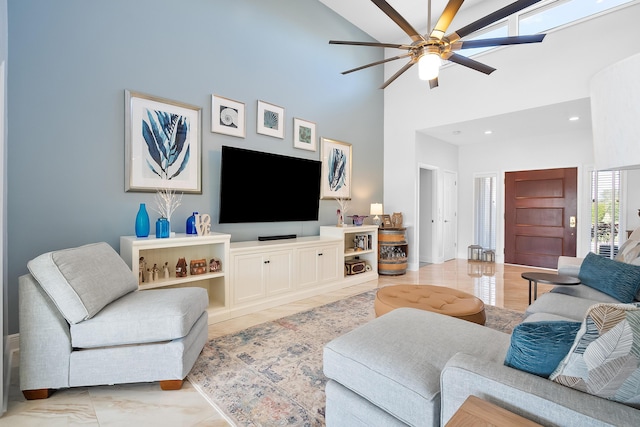 living room featuring high vaulted ceiling and ceiling fan