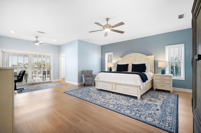 bedroom with ceiling fan, light hardwood / wood-style floors, and access to outside