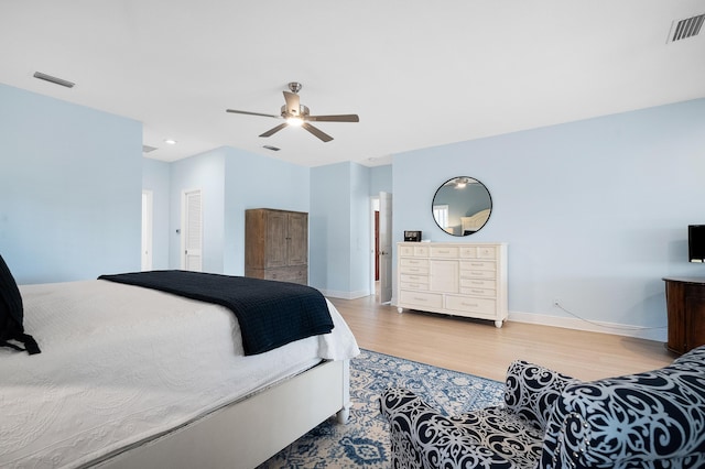 bedroom with wood-type flooring and ceiling fan