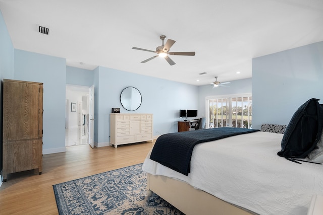 bedroom featuring light hardwood / wood-style floors and ceiling fan