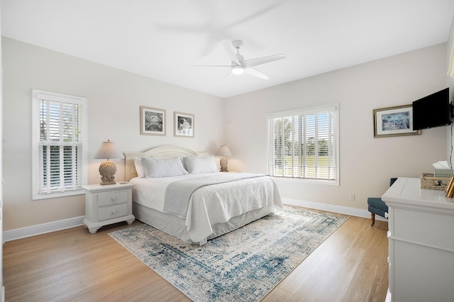 bedroom featuring ceiling fan and light hardwood / wood-style flooring