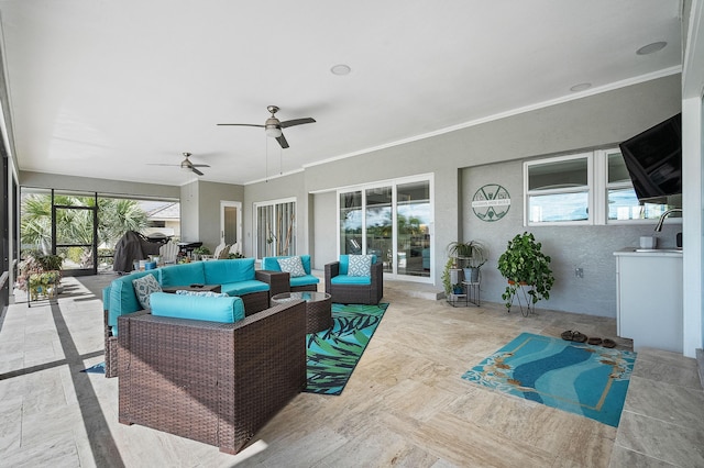 view of patio / terrace featuring an outdoor living space, sink, and ceiling fan