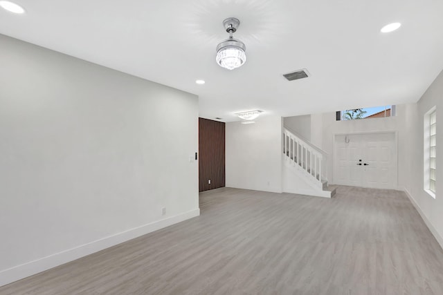 unfurnished living room featuring light wood-type flooring