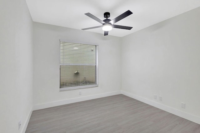 unfurnished room featuring ceiling fan and light wood-type flooring