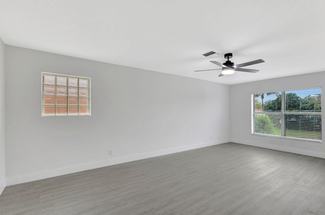 empty room featuring ceiling fan and hardwood / wood-style floors