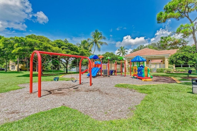 view of jungle gym featuring a lawn