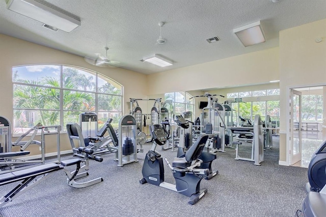 gym with a textured ceiling