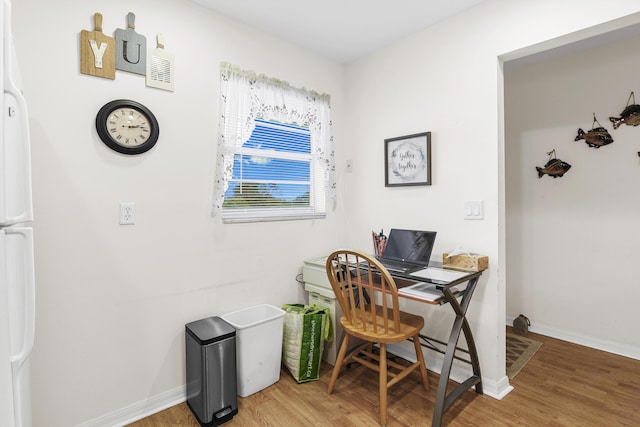 office space with hardwood / wood-style flooring