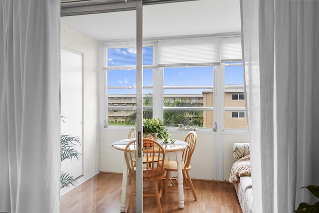 dining area with hardwood / wood-style flooring