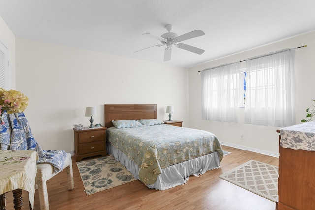 bedroom featuring hardwood / wood-style flooring and ceiling fan