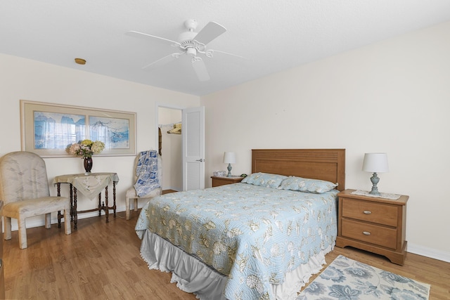 bedroom featuring ceiling fan and light wood-type flooring