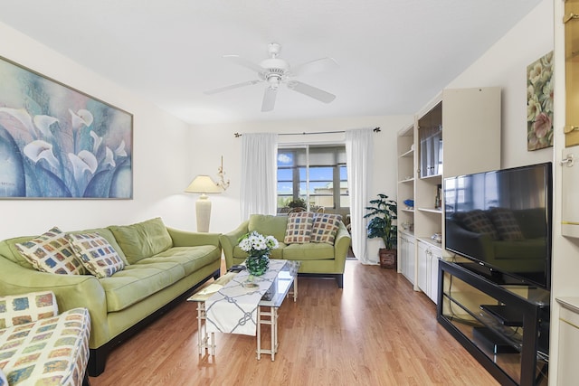 living room with ceiling fan and hardwood / wood-style floors