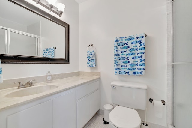 bathroom featuring vanity, an enclosed shower, tile patterned floors, and toilet